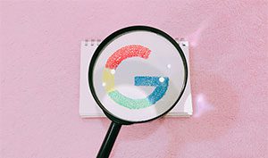 Google search showing magnifying glass with Google logo below it