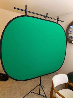 Zoom meeting tips green screen hanging from t shaped stand